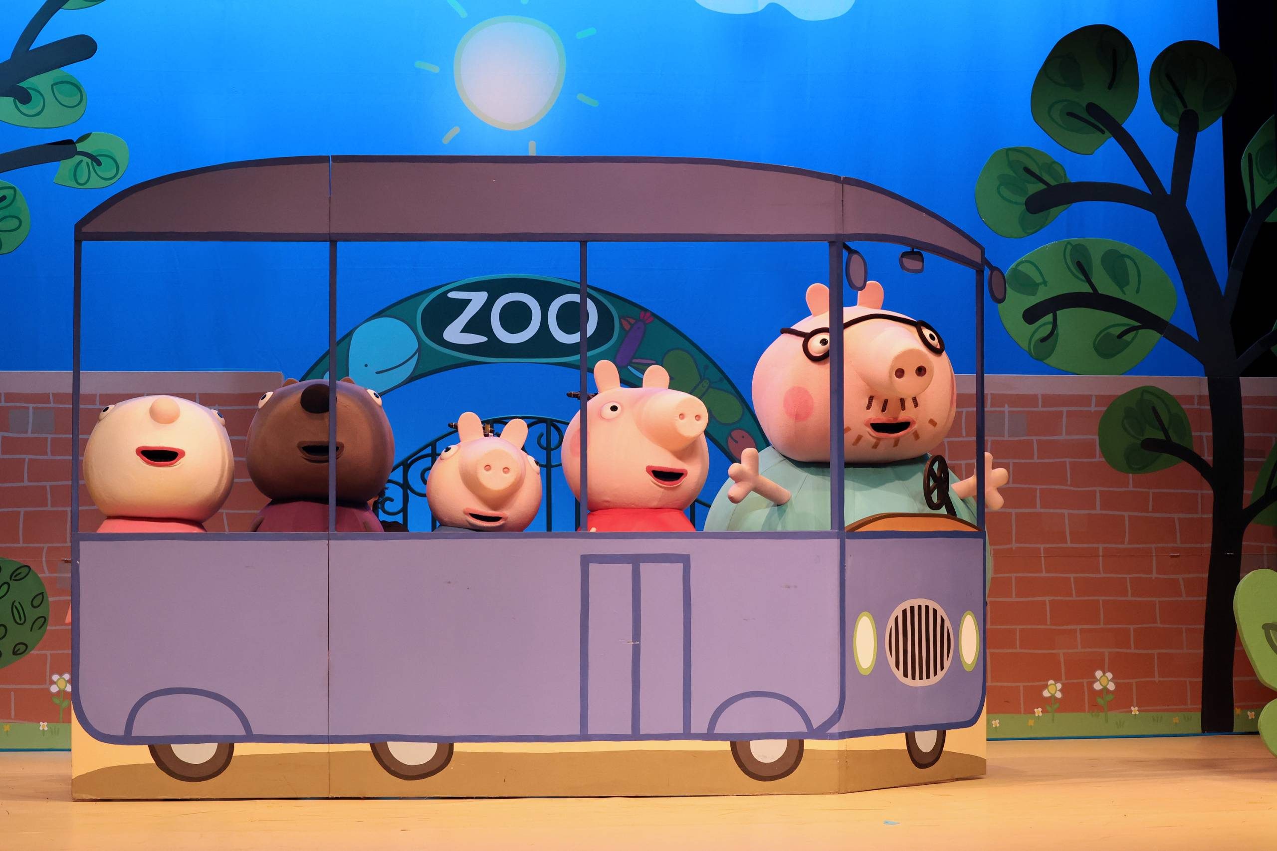 Peppa Pig, Daddy Pig and friends on a bus.