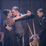 Shoko Ito 'Romanian Princess' and Will Bozier 'The Stranger' dance together, dressed in black as Dominic North 'The Prince' watches