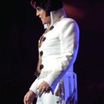 Shawn Klush in classic Elvis white high-collared suit