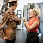 Anne-Marie Piazza points at the chest of Alexander Ballinger's military uniform