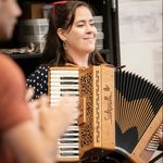 Sally Swanson playing accordian