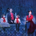 Mary Poppins in red coat sitting primly on a rooftop at night with Bert the chimney sweep and children Jane and Michael Banks