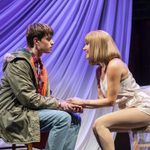 Rodney (Tom Major) and Cassandra (Nicola Munns) sit knee to knee, hands clasped