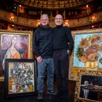 Man and Peter James in theatre surrounded by paintings