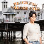 Fiona Wade standing on beach in front of Brighton Palace Pier