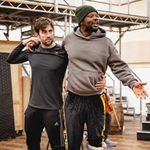 Ben Mabberley (Hank & Stage Door Keeper) supporting Luke Wilson (Danny Gilmartin), arms around each other as Luke speaks animatedly off camera