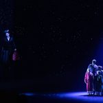 Mary Poppins (Stefanie Jones) holds out her umbrella nad flies away in the night sky as George Banks (Michael D Xavier), Winifred Banks (Lucie-Mae Sumner), Michael Banks (Charlie Donald), and Jane Banks (Florence Swann) huddle together to see her off.