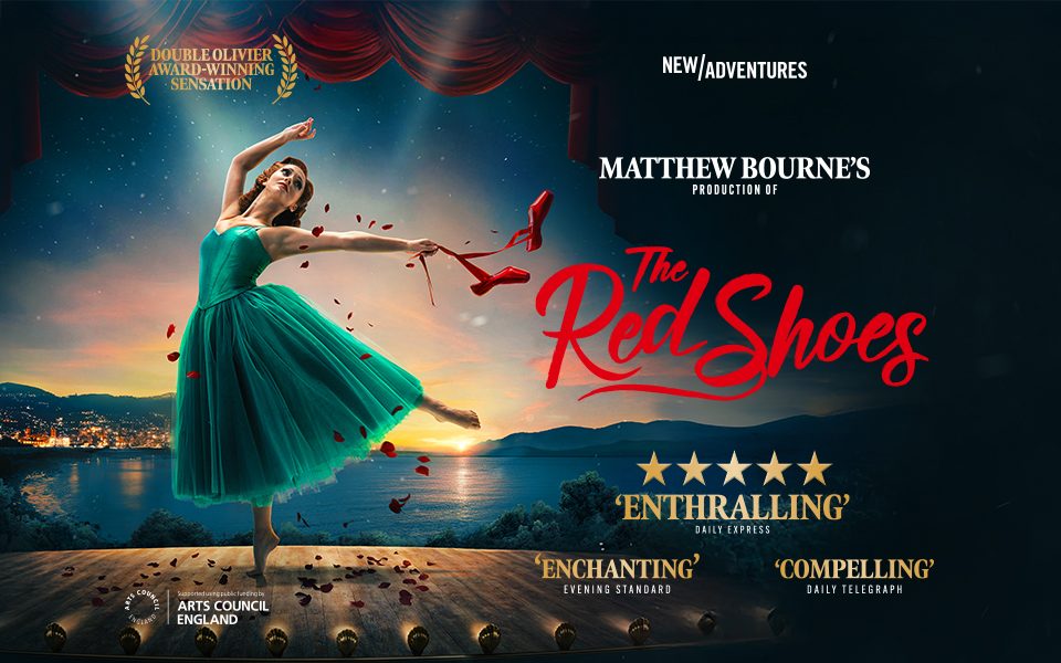 Red Shoes_Southampton_EventCard_960x600px White woman in green dress en pointe on one foot, waving red ballet shoes in one hand, standing on wooden stage overlooking sunset lake.