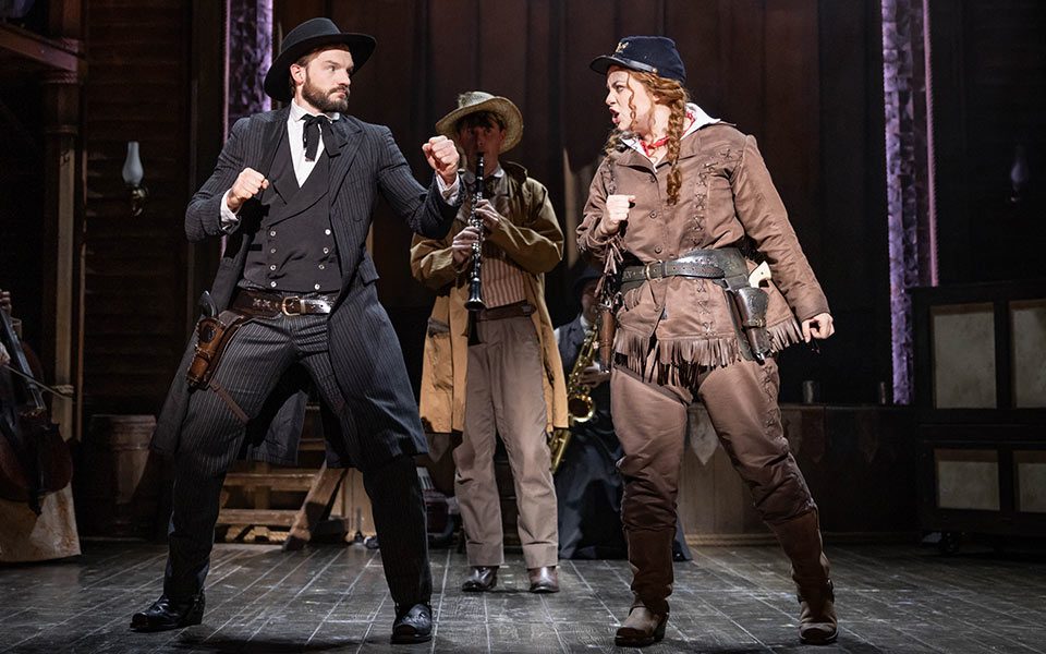 Calamity Jane spars with cowboy in a bar