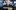 The central figure is a smiling Kevin Keegan, an older man with white hair, wearing a suit and tie. Around him, in faded blue tones, are four younger images of him in various football kits, representing different stages of his career. The title 