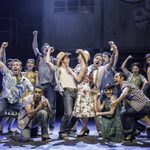 A full cast photo during one of the musical numbers